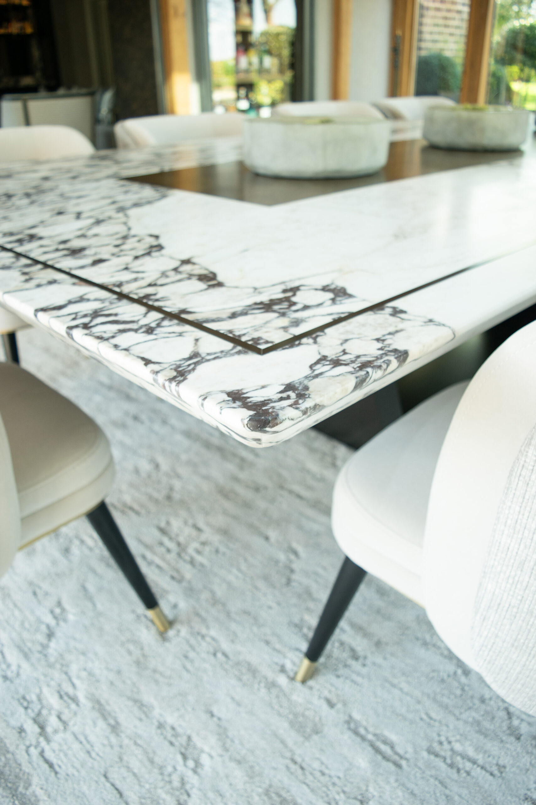 Marble table edging and bronze inlay detailing