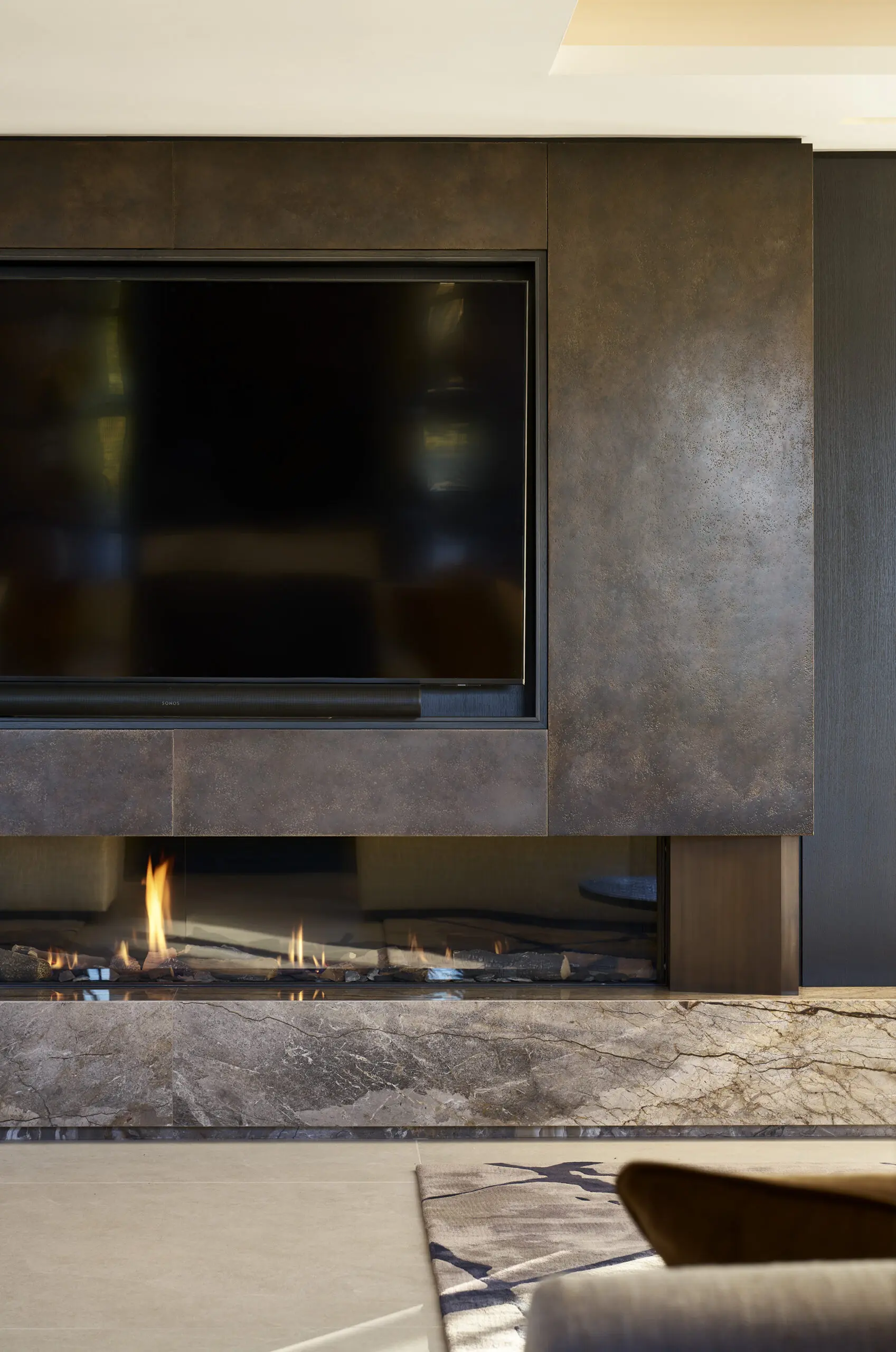 674 Whitbrow Heights - marble and bronze fire surround and media wall